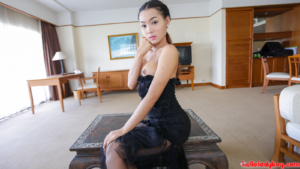 Gorgeous transgirl poses seductively in black dress