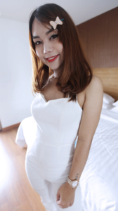 A playful party girl Ning poses with pretty bow in hair