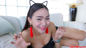 Playful Ladyboy shows cleavage while looking pretty in mouse ears