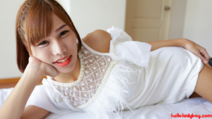 Feminine Ladyboy looking pretty posing in white dress