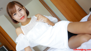 Bangkok transgirl poses seductively in white dress