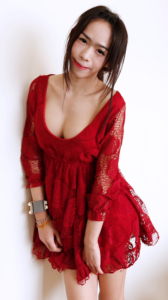 Ai posing in red lace dress showing cleavage
