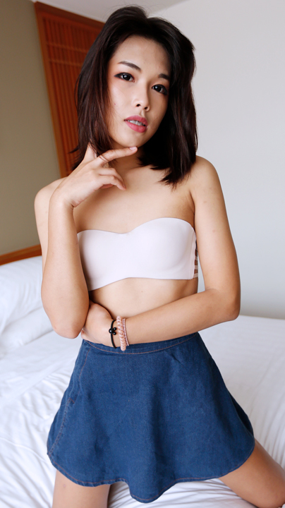 Pream posing seductively wearing tube top and skirt